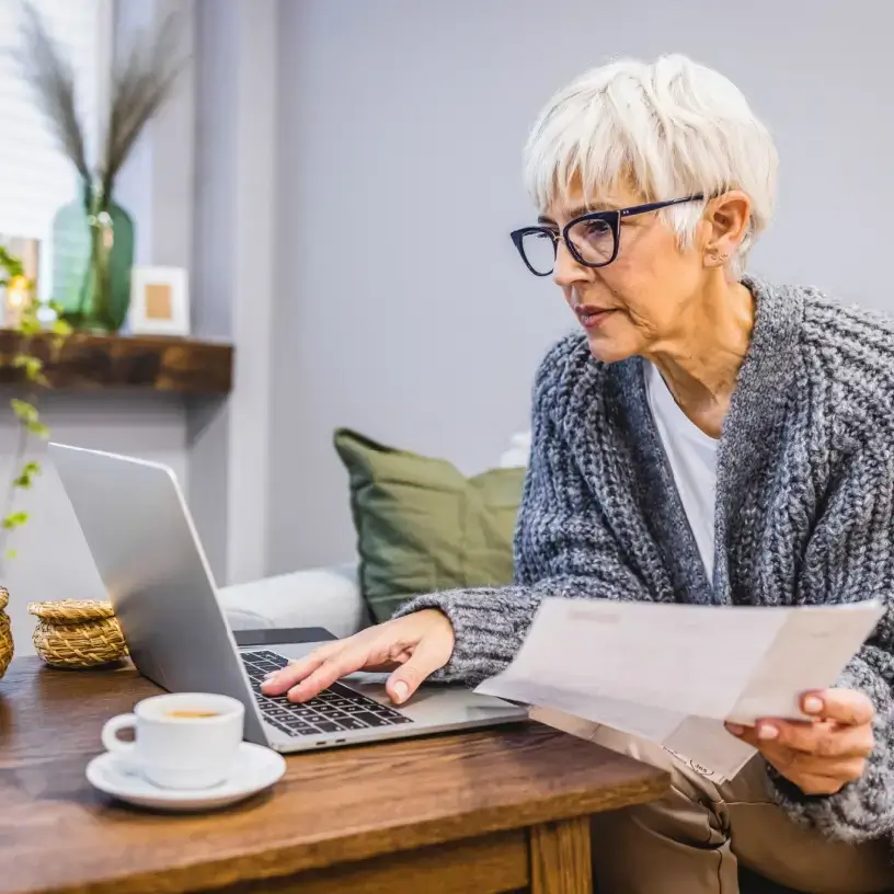 Older woman reading her bill